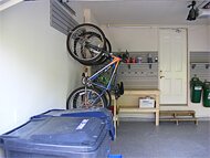 Left Wall - bike rack, slatwall organizer, garbage bin storage, workbench, shelves, hooks